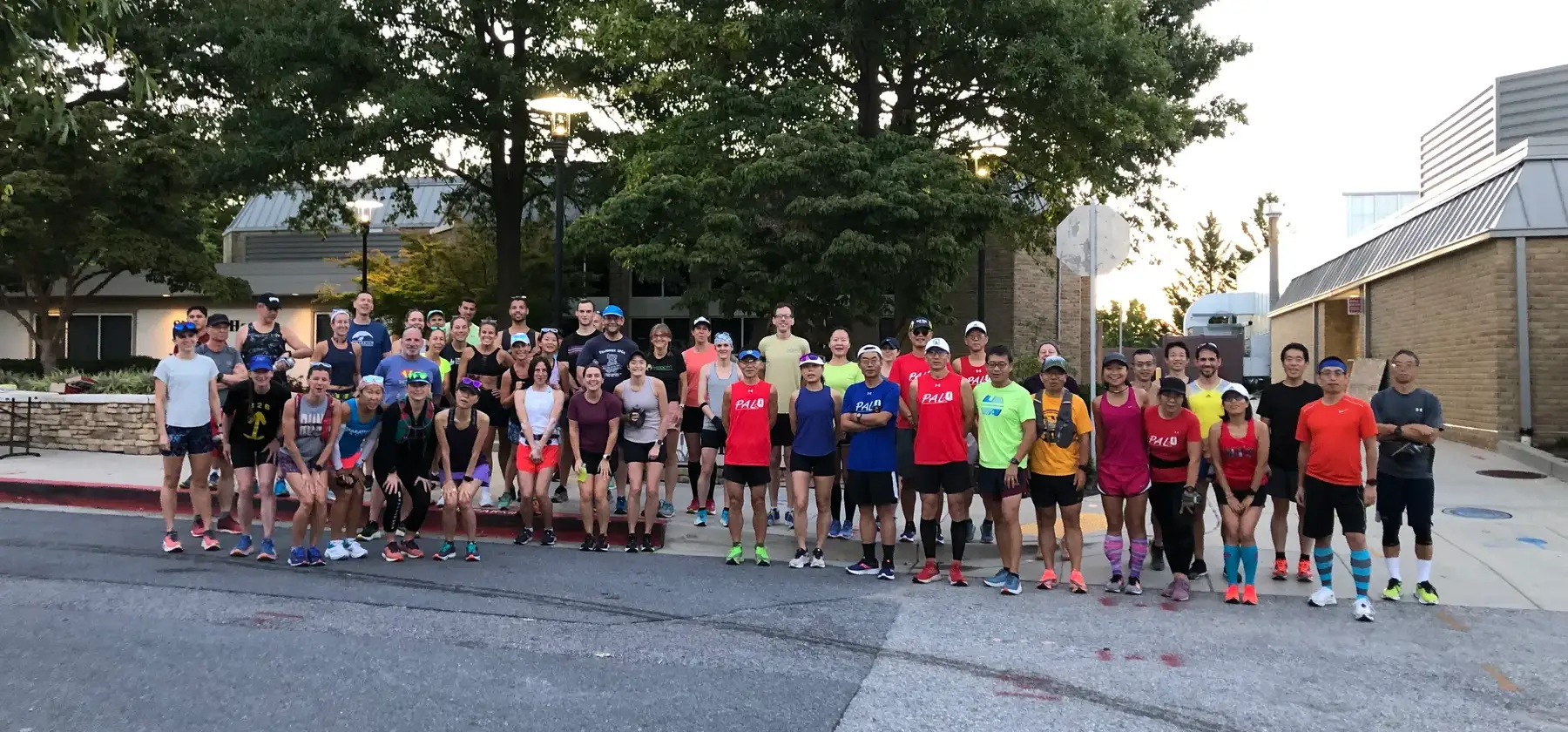 Runners heading down the road at sunrise on race morning
